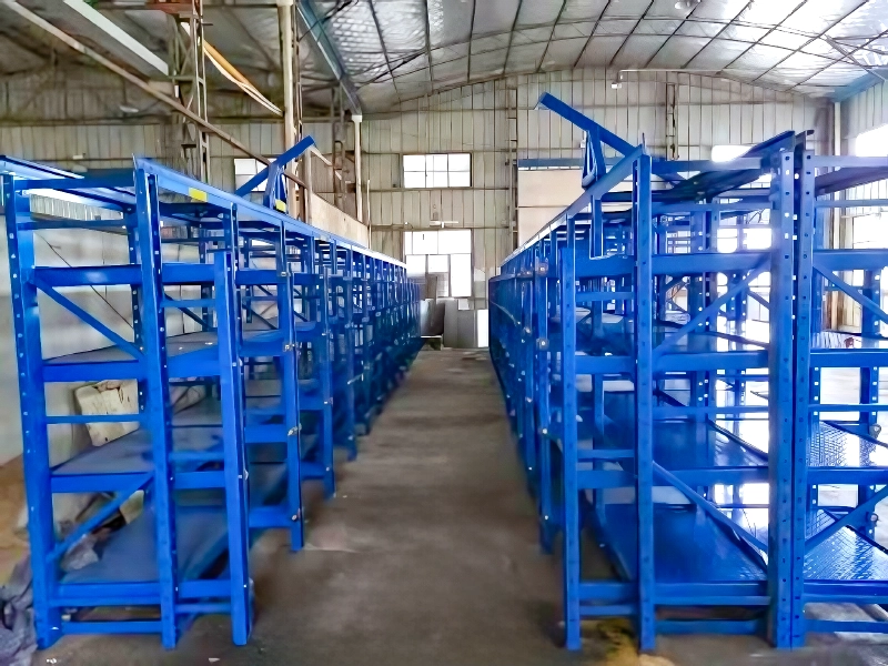 How Drawer Mould Rack Storage Helps a North American Security Hardware Toolroom Keep Changeovers Moving 4 Blue roll-out mold rack with steel drawer frames and overhead crane access in workshop aisle